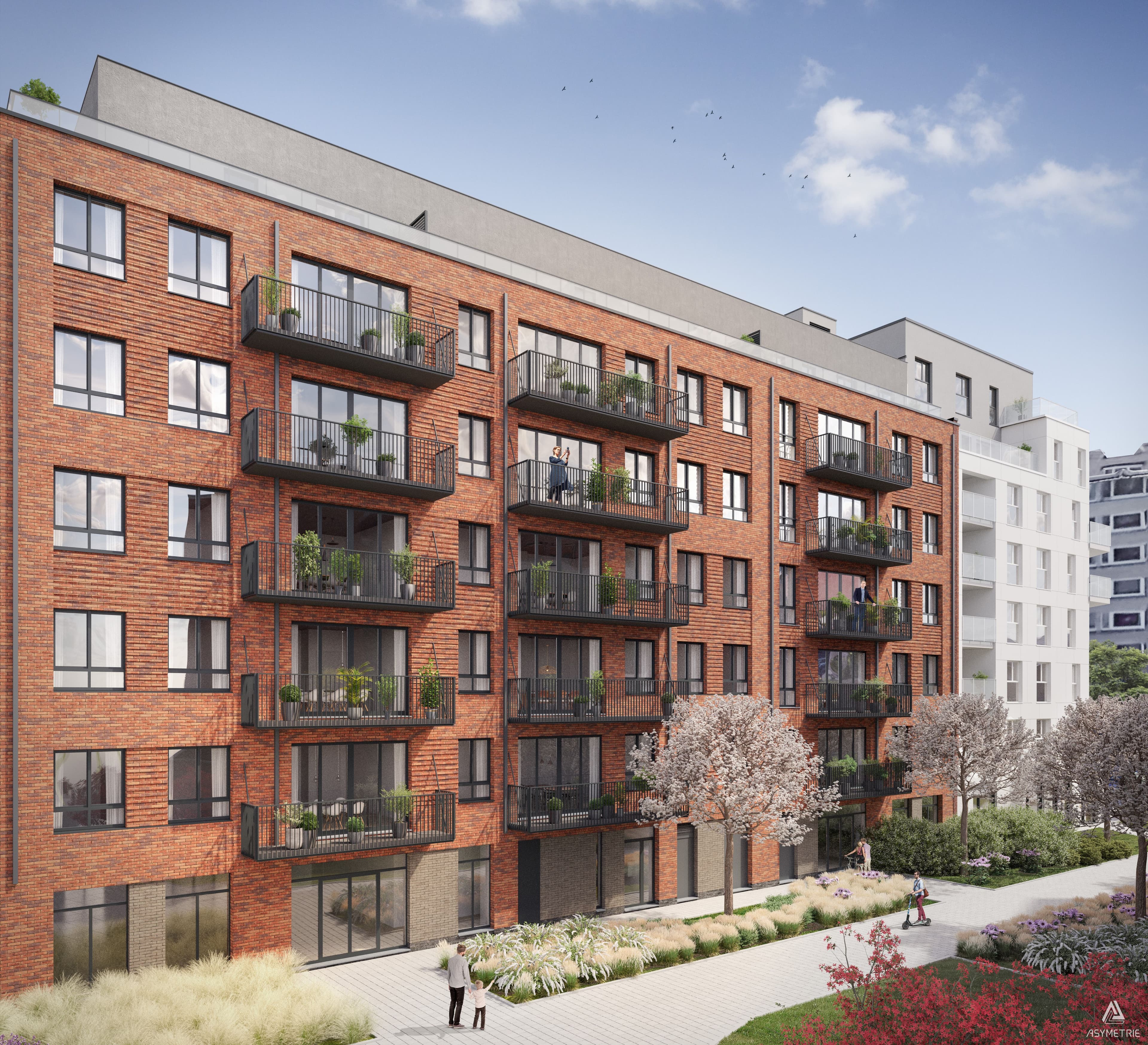 Immeuble résidentiel en briques avec balcons filants et terrasses végétalisées. Le bâtiment s’ouvre sur des espaces paysagers avec cheminements piétons et plantations.