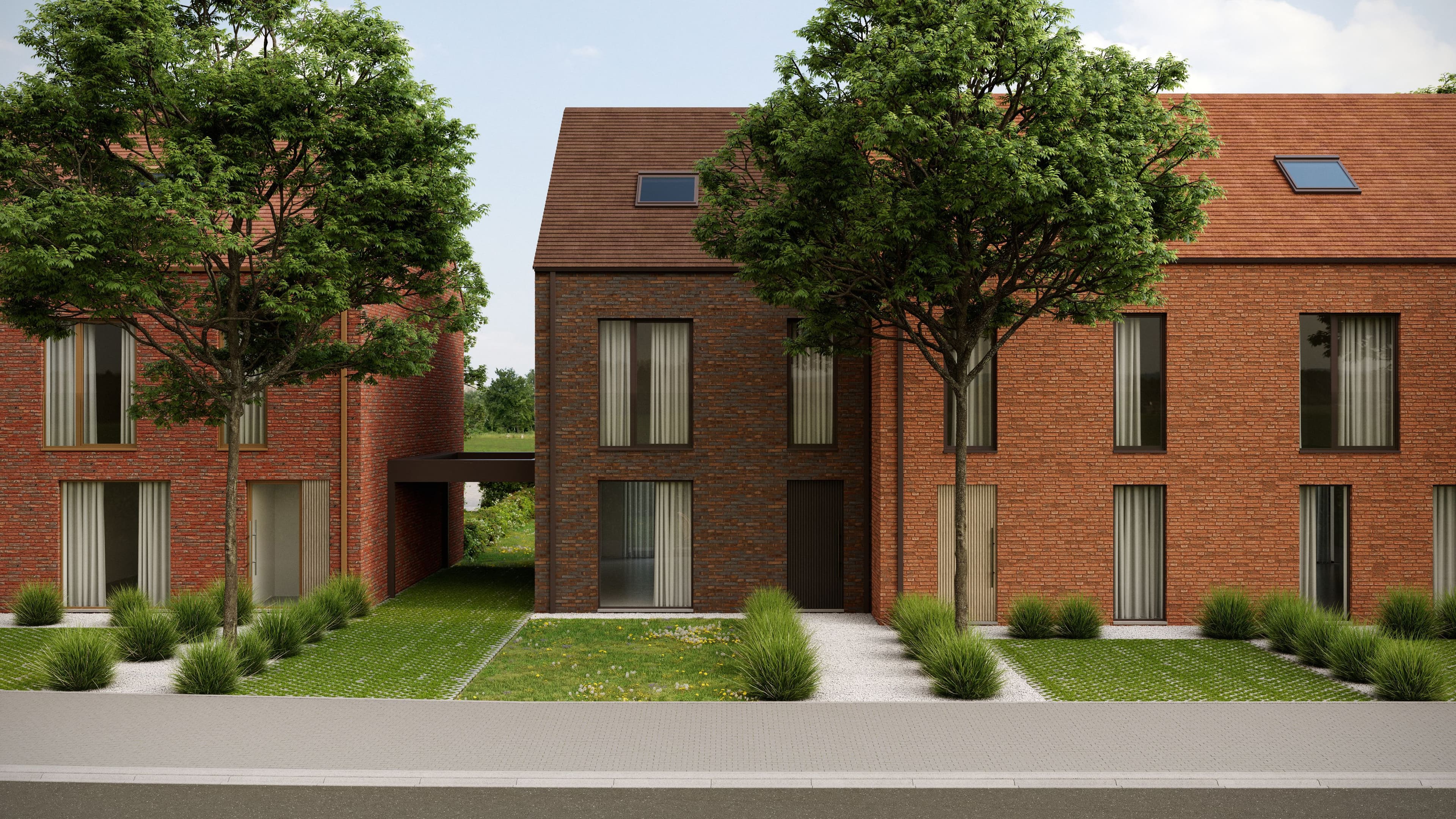 Maisons contemporaines en briques avec volumes simples et ouvertures verticales. Les habitations s’intègrent dans un cadre verdoyant avec aménagements paysagers soignés.