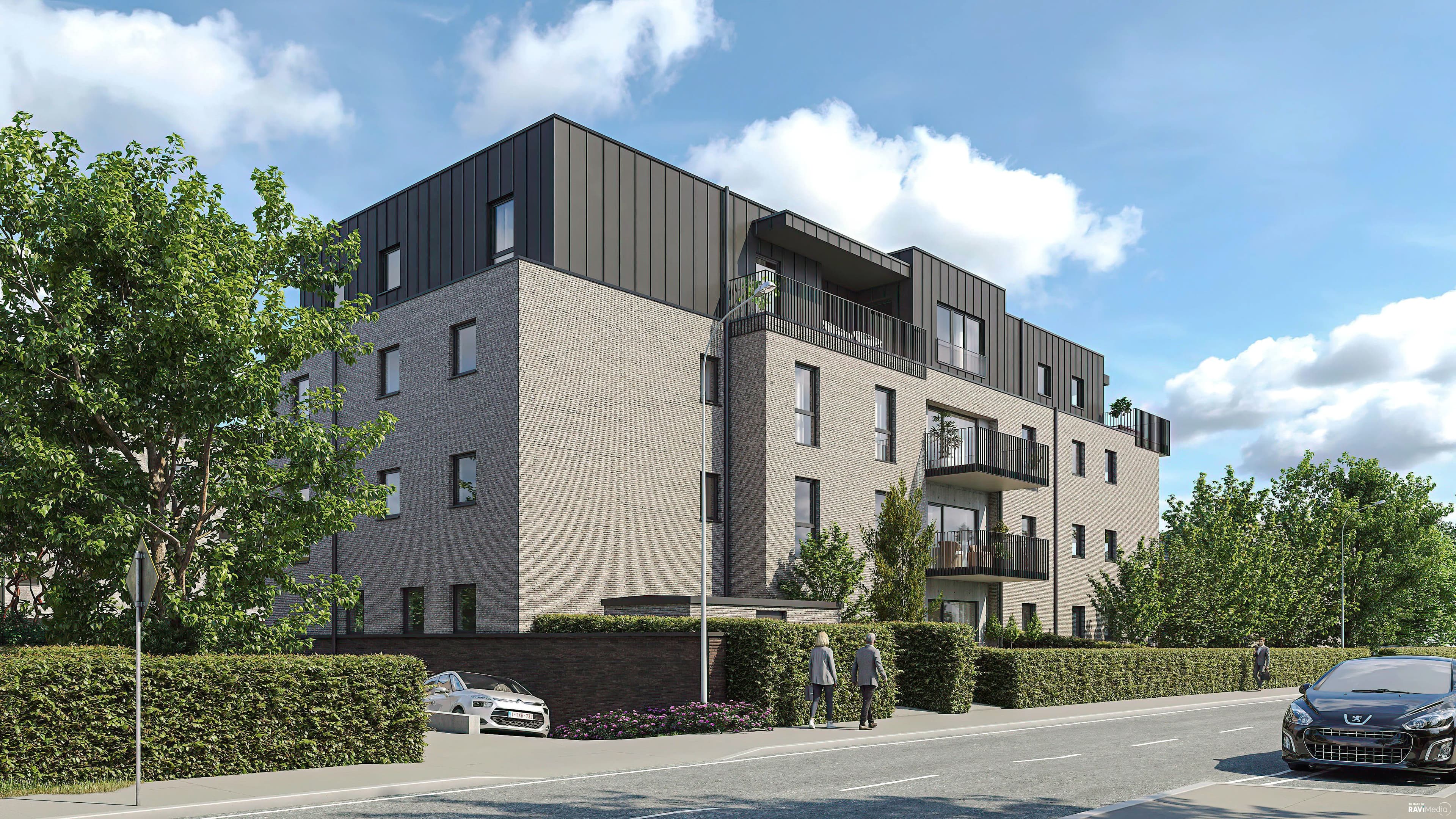 Immeuble résidentiel contemporain en briques claires avec attique sombre et balcons. Le bâtiment est entouré de verdure et situé en bord de rue dans un environnement calme.