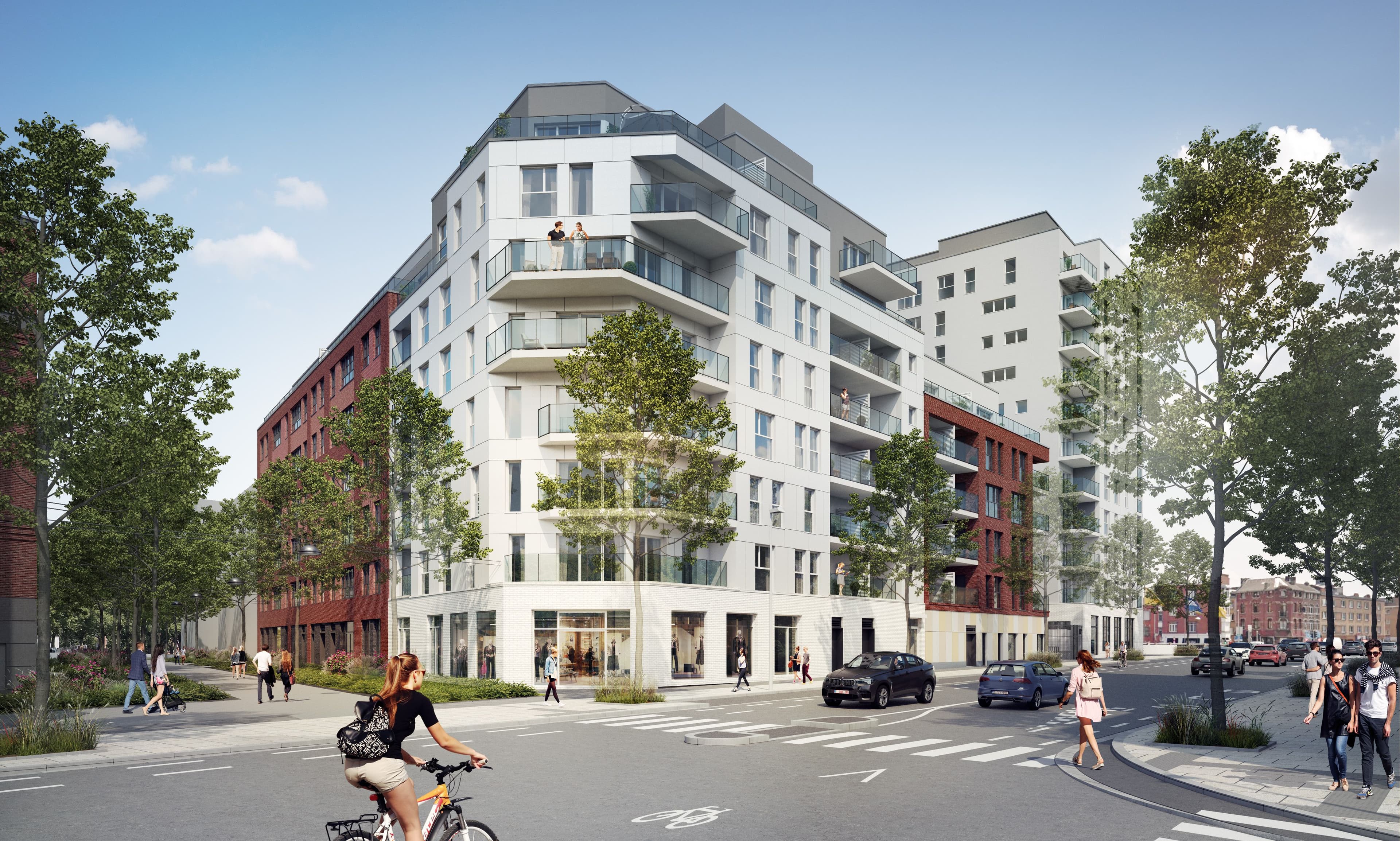 Immeuble résidentiel contemporain avec commerces en rez-de-chaussée, situé à l’angle d’une rue urbaine. Le bâtiment intègre balcons, terrasses et espaces arborés dans un environnement dynamique.
