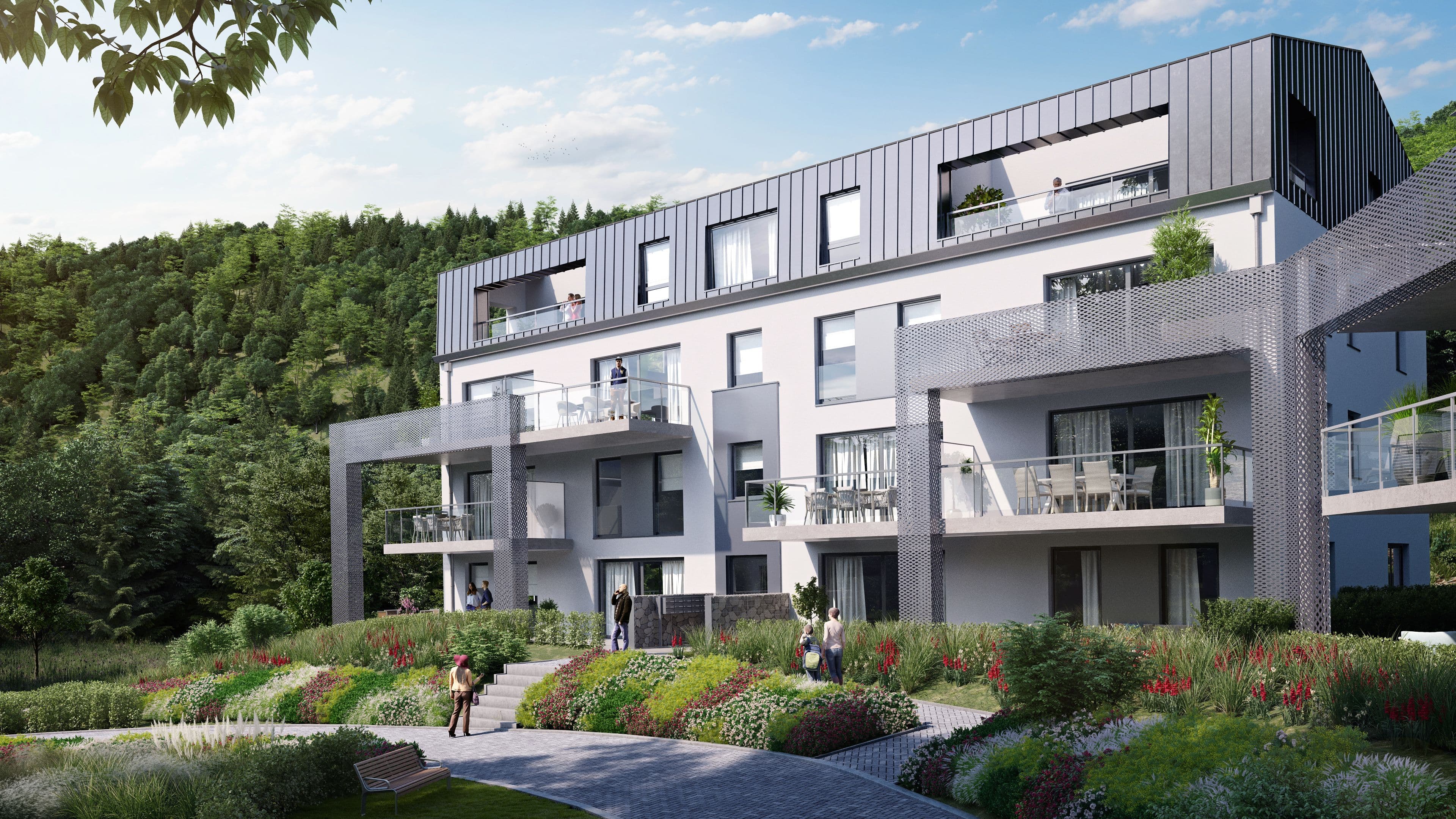 Immeuble résidentiel contemporain avec larges terrasses et balcons, intégré dans un environnement verdoyant en pente. Les aménagements paysagers soignés et la proximité de la nature renforcent le caractère résidentiel et apaisé du lieu.