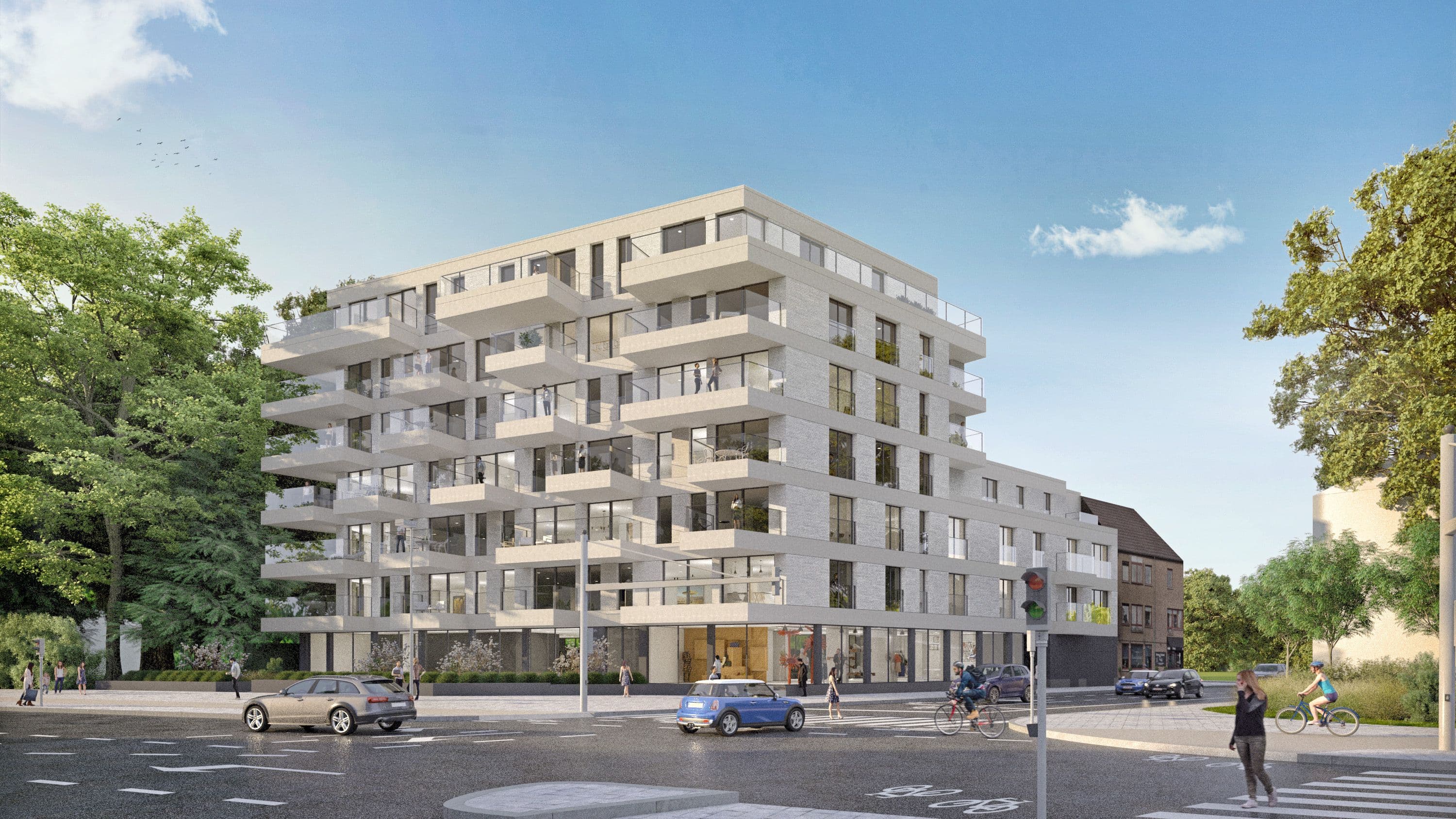 Résidence neuve de standing en pierre claire avec vastes balcons filants et commerces en rez-de-chaussée, idéalement située à un carrefour animé en Belgique.